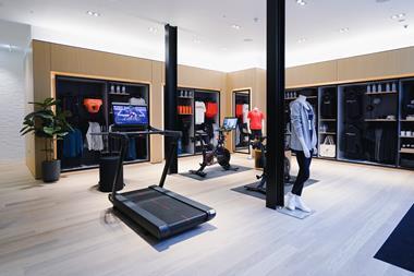 Interior of Peloton store, Covent Garden, London, showing a treadmill and apparel displays