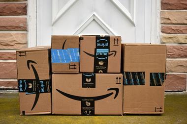 Stack of Amazon parcels outside door