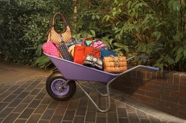 Luxury handbags in wheelbarrow