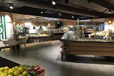 The bright delicatessen and hot food counters form a focal point of the new-look store.