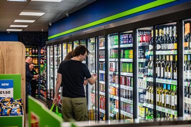 Customer at Asda convenience store fridges