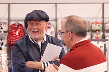 Asda chair Allan Leighton talks to a customer