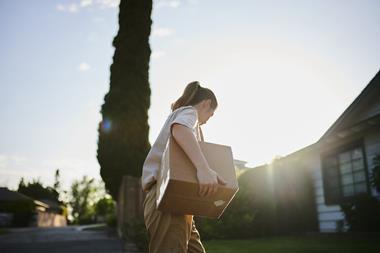 Postal worker delivering parcel