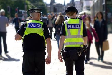 Police officers walking down street