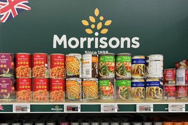 Cans of display in Morrisons with logo in background