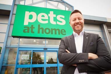 Peter Pritchard in front of a Pets At Home store