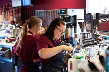 Costa employees making coffee