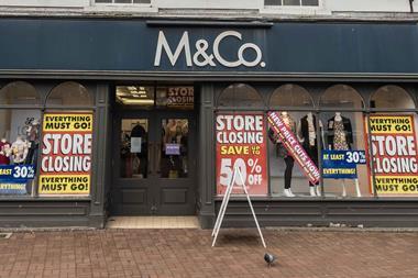 Exterior of M&Co in Nantwich, Cheshire with 'Closing down' signs in window