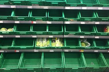Empty grocery shelves in a supermarket