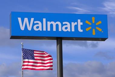 Walmart sign next to US flag