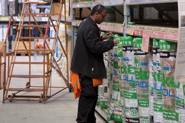 B&Q worker pricing up insulation rolls
