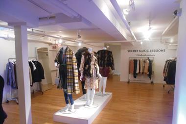 The store is a white box with computer monitors on the ground floor and mannequins wearing the products in the basement.