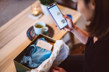 Woman ordering baby clothes online