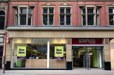 Staples has revealed plunging losses after it incurred restructuring costs when it closed 23 stores at the beginning of the year.