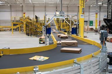 Amazon parcels on conveyor belt at delivery station