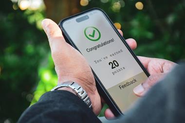 Phone displaying congratulation on earning loyalty points message
