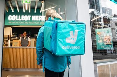 Driver collecting order at Deliveroo Hop store