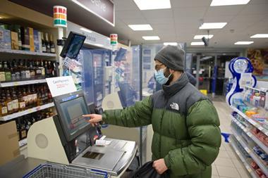 Man shopping in c-store wearing face mask