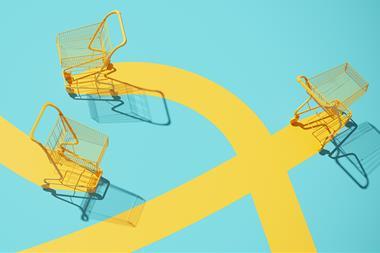 Yellow shopping trolleys on yellow and turquoise background