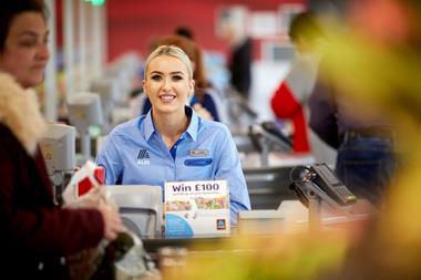 Aldi worker at checkout