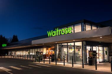 Exterior of Waitrose store at night