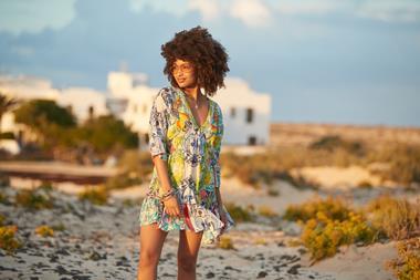 Female model wearing Joe Browns dress on beach