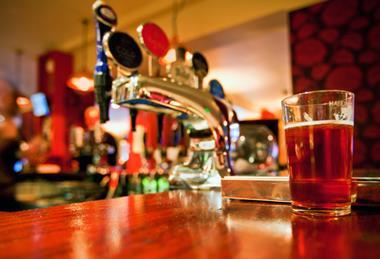 Pint of beer on a pub bar