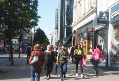 Shoppers on a sunny high street
