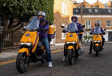 Three Getir delivery riders on a UK street