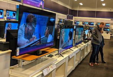 TVs on display in electricals store