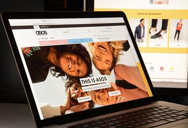 ASOS website homepage on laptop
