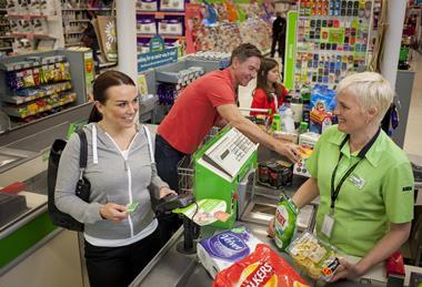 Woman shopping at an Asda checkout