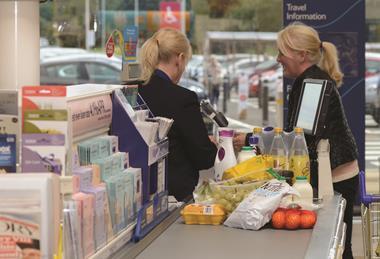 Retail staff working at a check-out