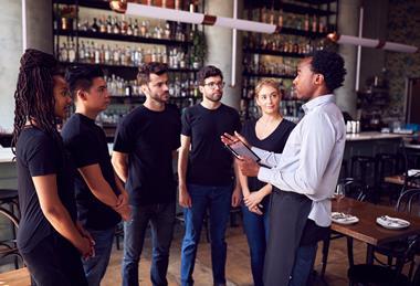 Apprentices being trained in a bar