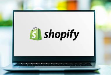Shopify logo on laptop screen