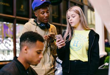 Teenagers on their phones