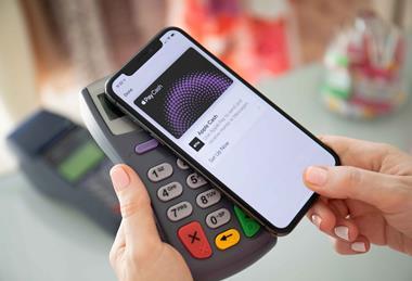 Customer-paying-with-phone-using-Apple-Pay