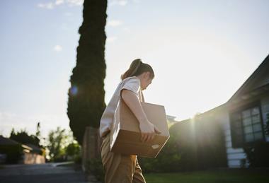 Postal worker delivering parcel