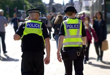 Police officers walking down street