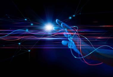 Hand on a dark background surrounded by lines of data