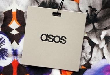 Asos label lying on top of a floral patterned garment