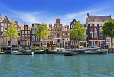 Historic gabled houses along Singel canal in Amsterdam