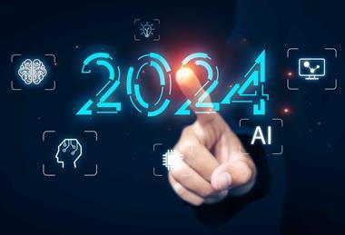Finger pointing at a screen that says 2024 and shows icons for a lightbulb, a screen, a brain, a circuit board and AI