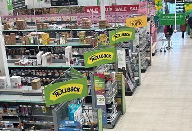 Asda Rollback sings on display in supermarket