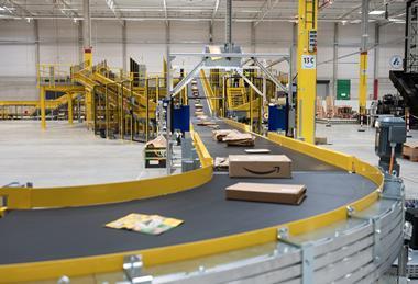 Amazon parcels on conveyor belt at delivery station