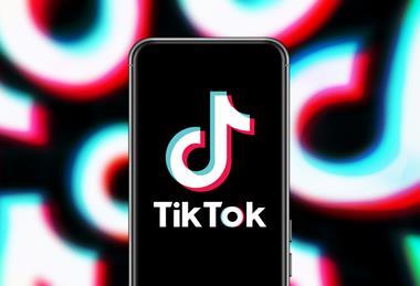 TIKTOK logo on phone screen