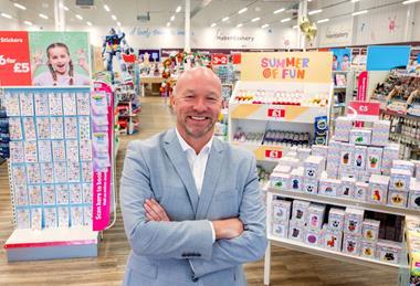 Hobbycraft boss Graeme Campbell in front of in-store display
