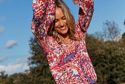 Woman wearing FatFace top and shorts