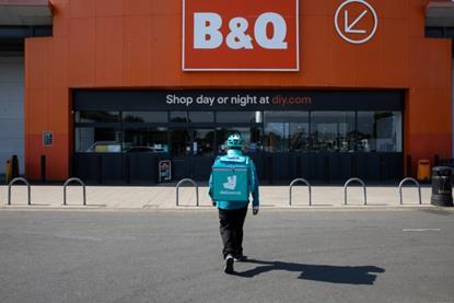 Deliveroo driver outside a B&Q store