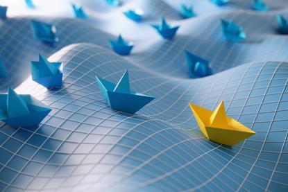 Paper boats on undulating sea with grid on top